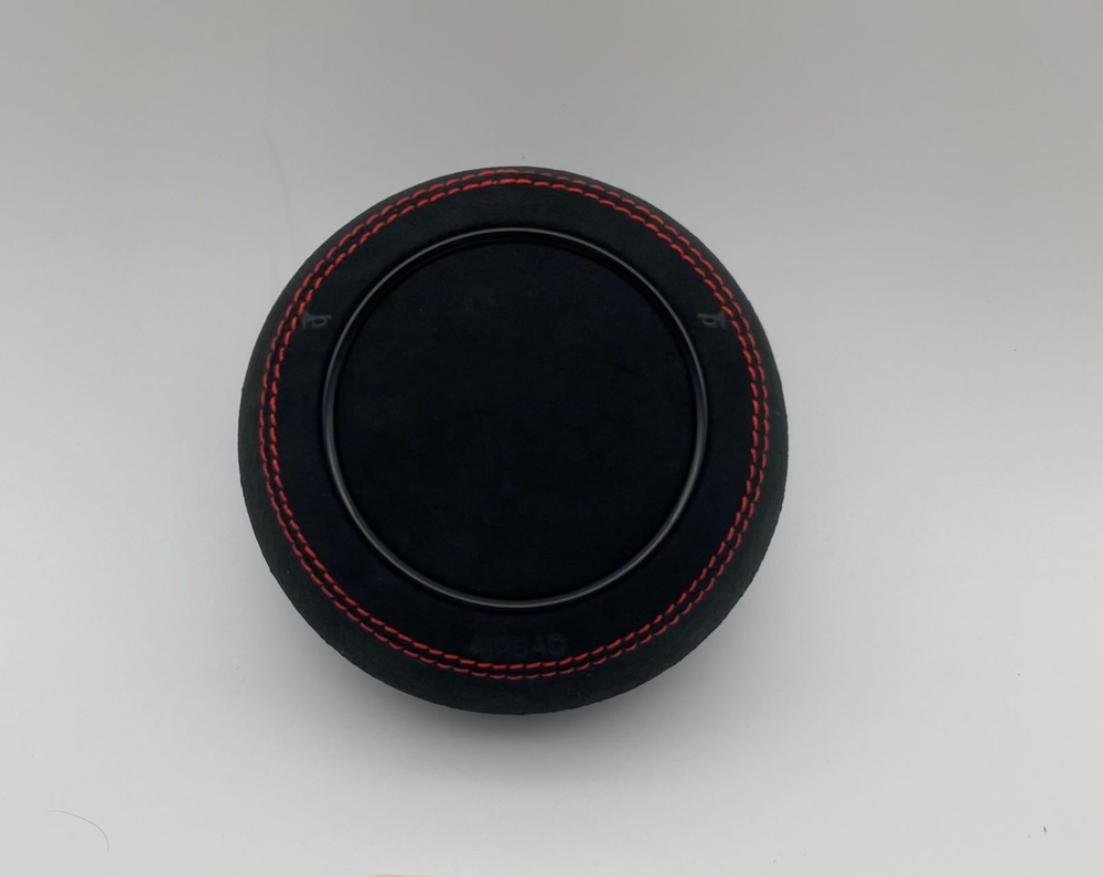 Audi custom airbag cover with black suede alcantara and red stitching
