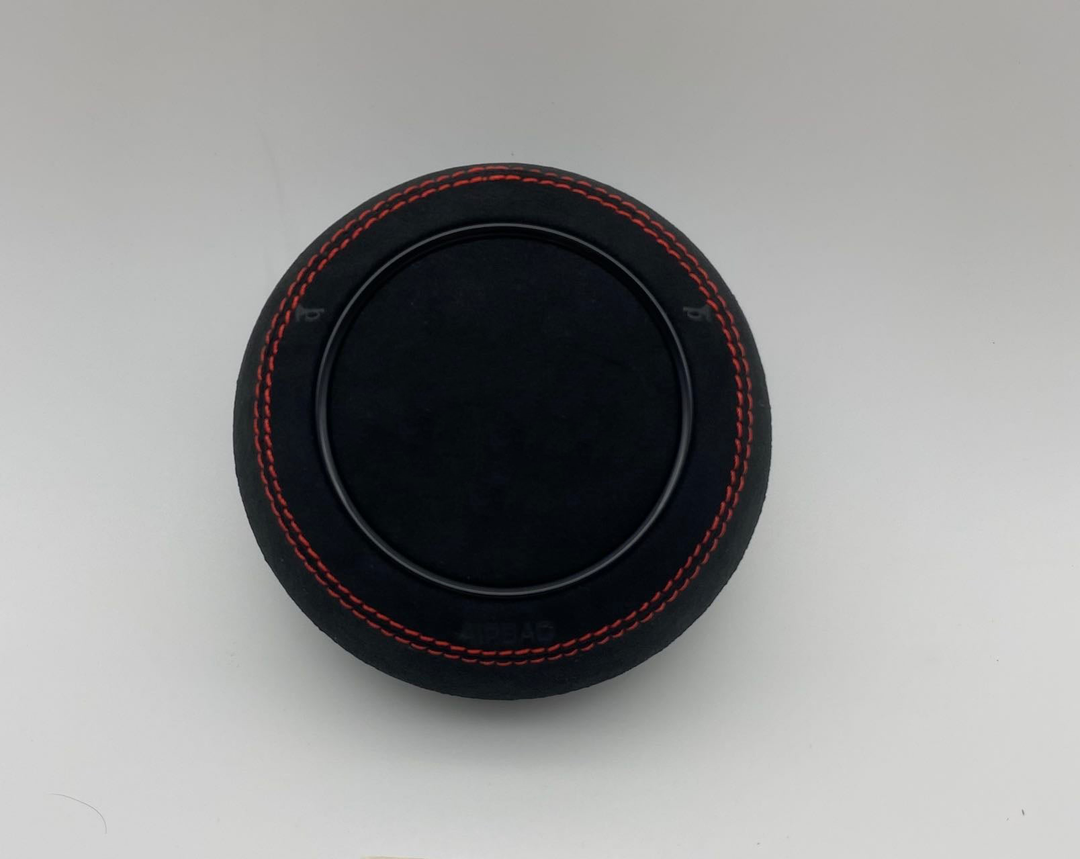 Audi custom airbag cover with black suede alcantara and red stitching