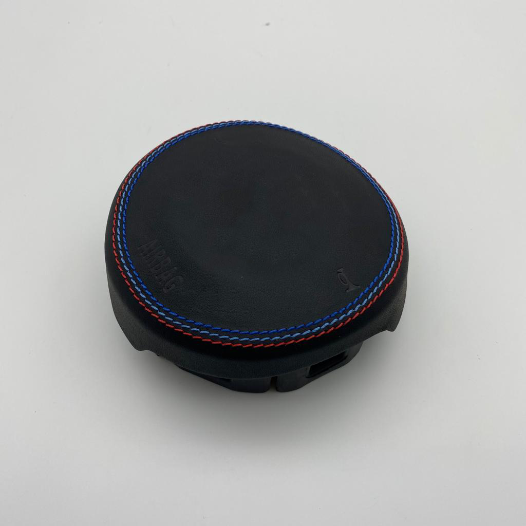 BMW custom airbag cover with tri-color stitching